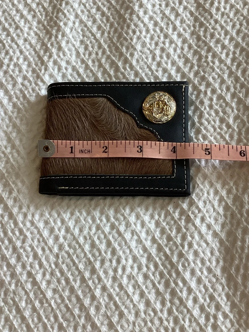 Men's Black and Brown Haircalf Bifold Wallet with Gold Medallion